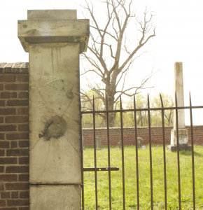 Pictured here is a damaged wall of the Willis Hills Cemetery, which was a result of the Civil War 