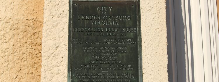 Pictured here is Cooperation Courthouse's building plaque