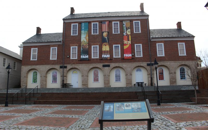Pictured here is the rear view of the second town hall and the site of the first town hall and market square