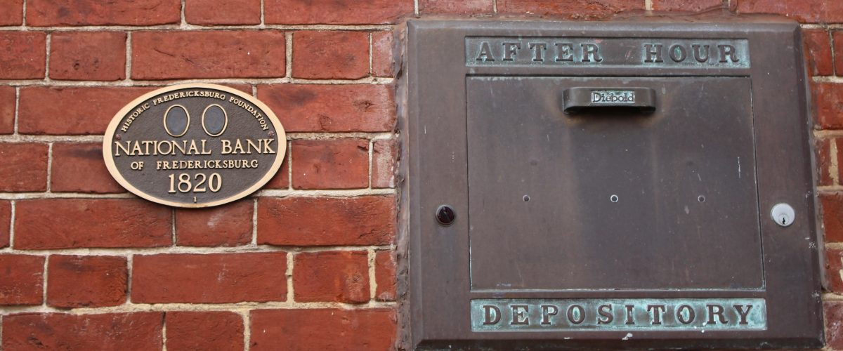 Pictured here is the historic building marker and the after hours depository